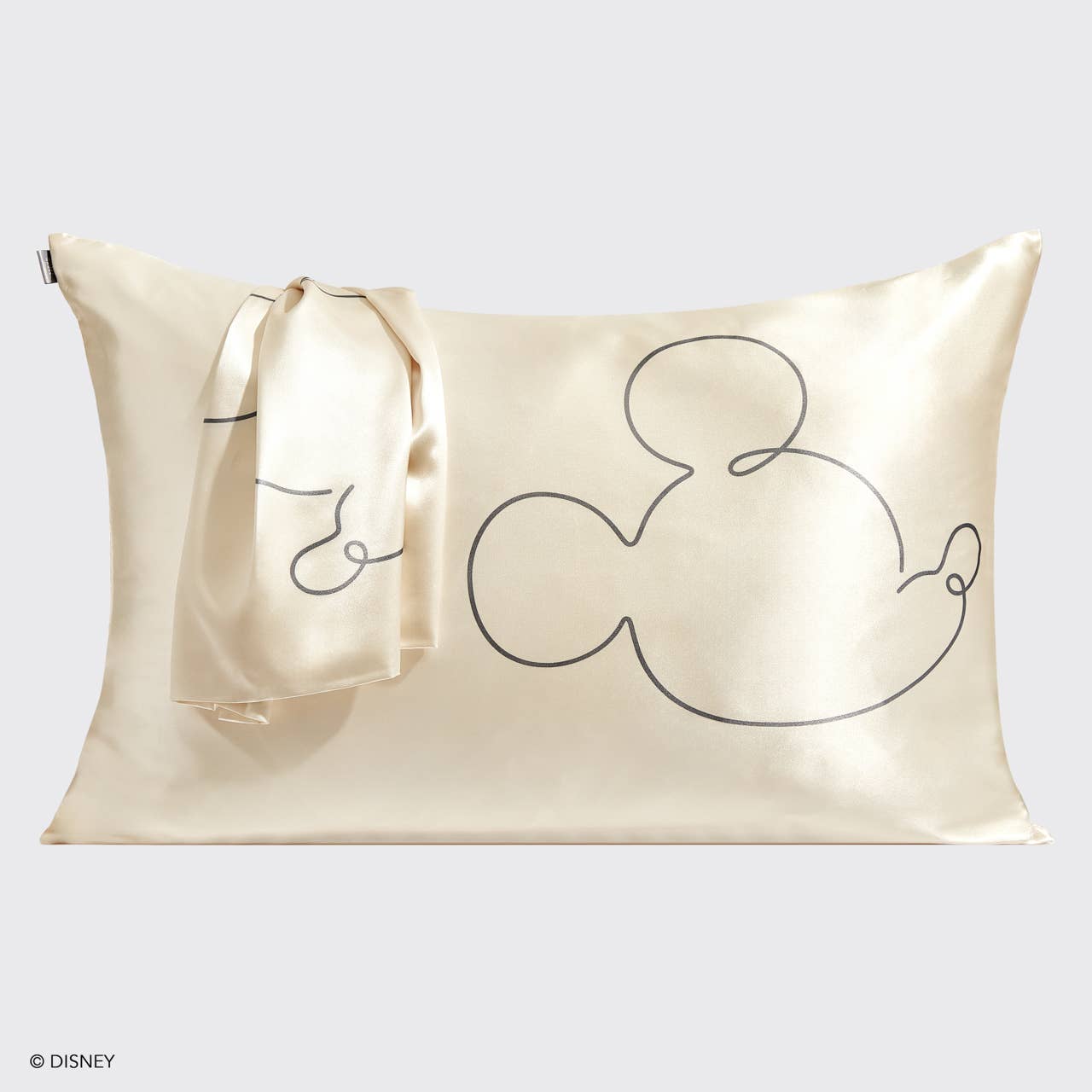 Silky cream pillowcase and scarf set with simple black line drawing of Mickey Mouse silhouette, luxury gift from Blyskt Orlando gifting