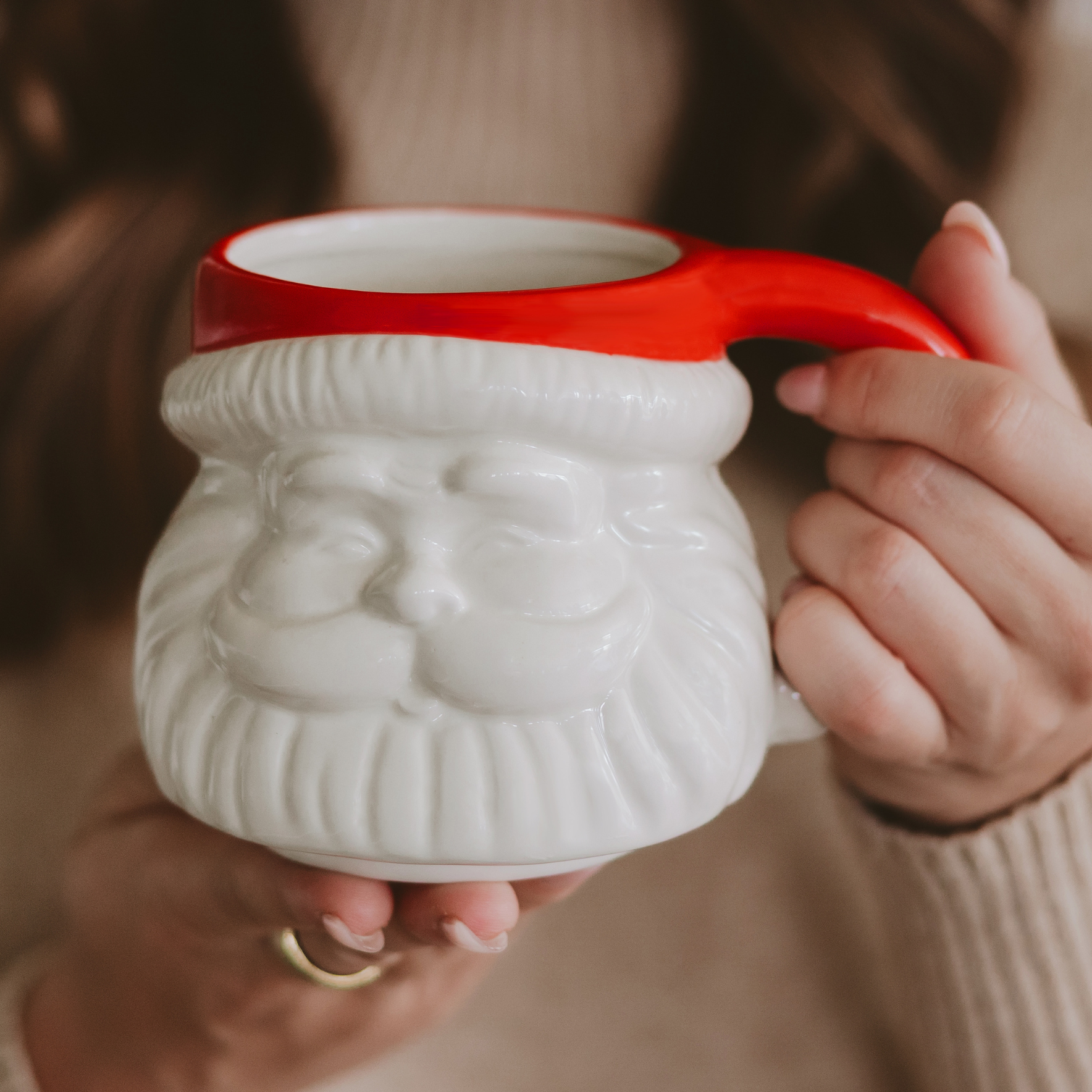 Blyskt White mug with red handle held by a person