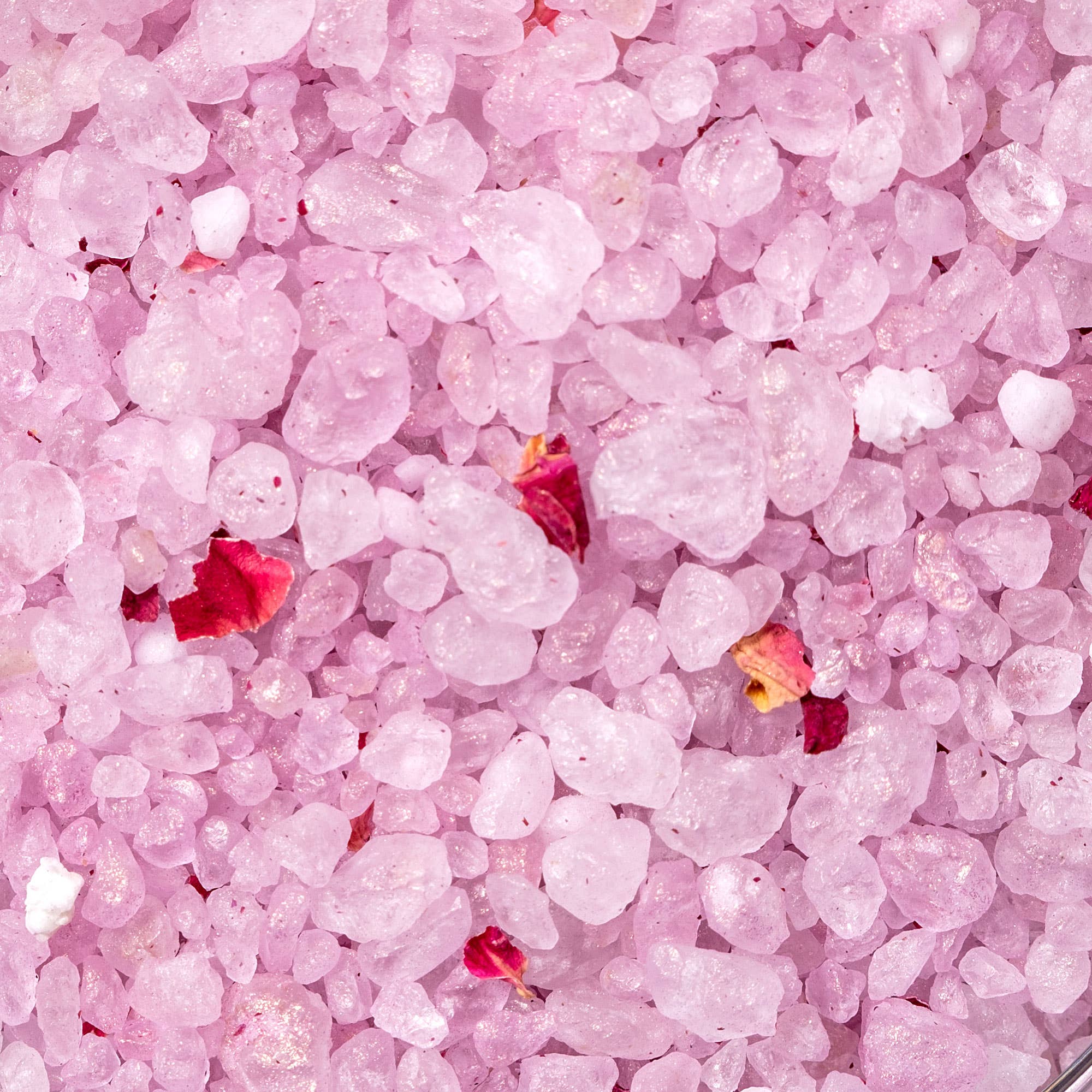 Close-up of pink bath salts with small red rose petals, luxury gift for Orlando gifting by Blyskt