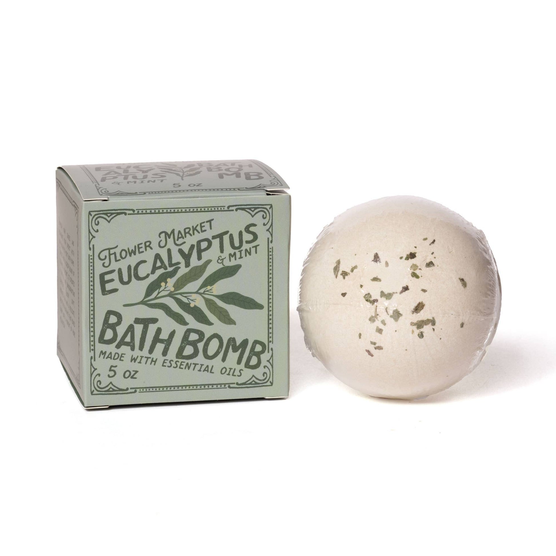 Eucalyptus and mint bath bomb with essential oils beside green packaging box, Orlando gifting by Blyskt