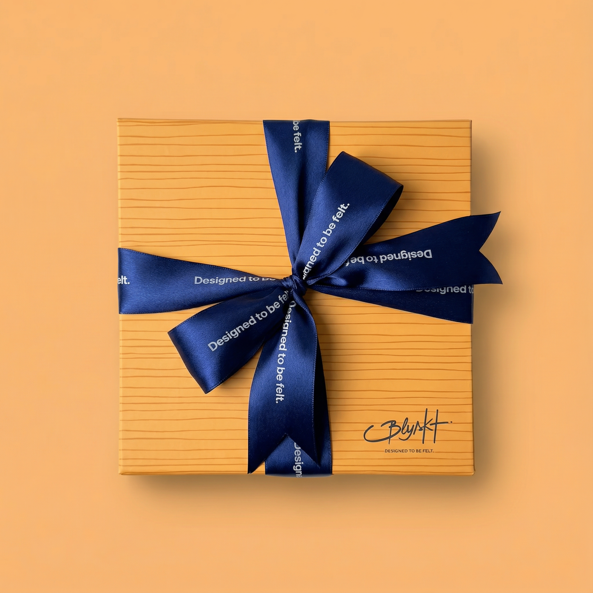 Blyskt Luxury Gift box with a blue ribbon on an orange background